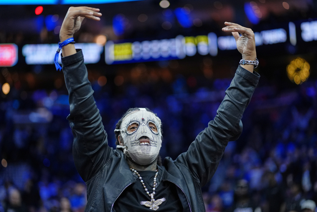 FILE - Rapper Skrilla reacts during an NBA basketball game Thursday, Dec. 4, 2025, in Philadelphia. (AP Photo/Matt Slocum)