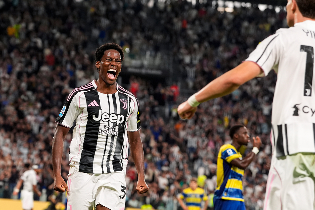 Juventus's Jonathan David celebrates after scoring the first goal for his team during the Italian Serie A soccer match between Juventus and Parma at the Juventus Stadium in Turin, Italy, Sunday, Aug. 24, 2025. (Fabio Ferrari/LaPresse via AP)