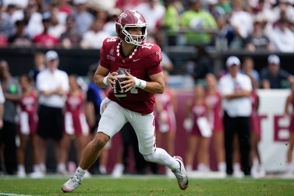 Temple's Jaxon Smolik looks to pass during the first half of an NCAA college football game against Penn State Saturday, Sept. 12, 2026, in Philadelphia. (AP Photo/Matt Slocum)