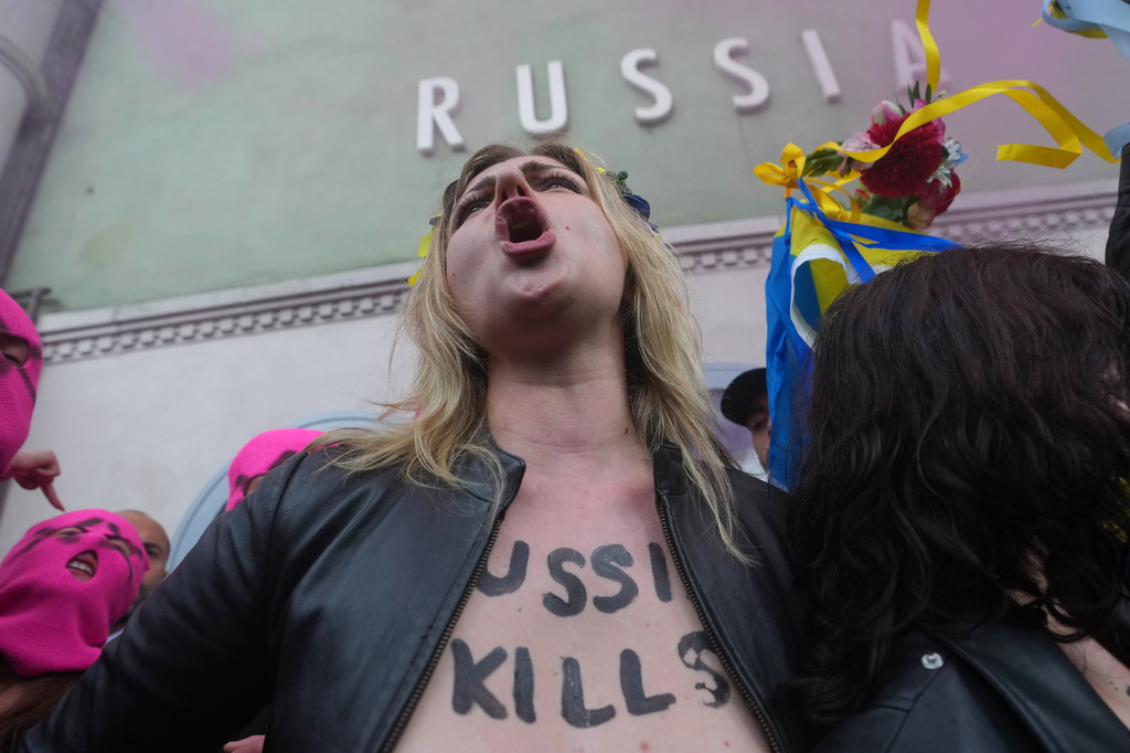 Pussy Riot and FEMEN activists stage a protest against Russia's presence after its absence following the 2022 invasion of Ukraine in front of the Russian pavilion, at the 2026 Art Venice Biennale, in Venice, Italy, Wednesday, May 6, 2026. (AP Photo/Luca Bruno)