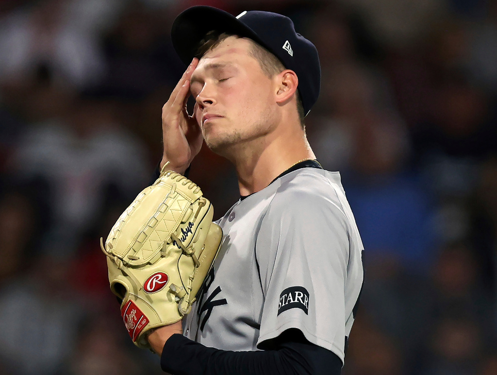 New York Yankees starting pitcher Will Warren reacts on the mound during the bottom of the first inning of a baseball game against the Boston Red Sox, Sunday, Sept. 14, 2025, in Boston. (AP Photo/Jim Davis)