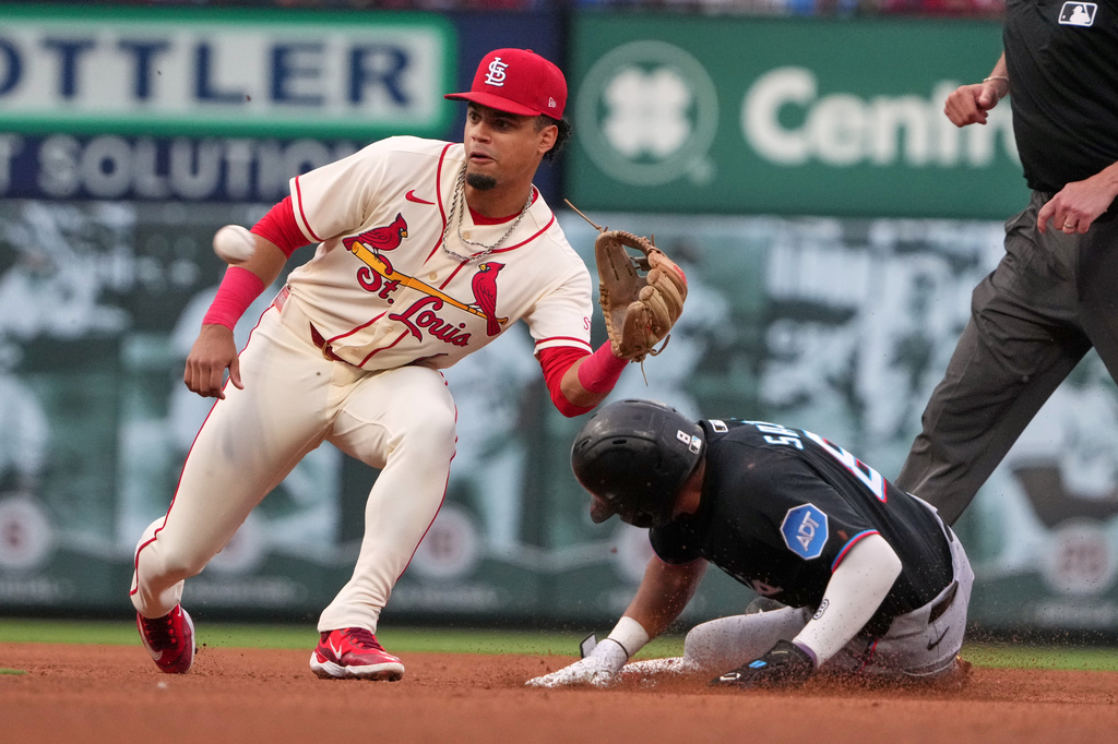 Miami Marlins' Javier Sanoja, right, steals second as St. Louis Cardinals shortstop Masyn Winn handles the throw during the fourth inning of a baseball game Saturday, June 27, 2026, in St. Louis. (AP Photo/Jeff Roberson)