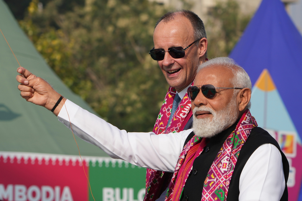 Indian Prime Minister Narendra Modi, right, and German Chancellor Friedrich Merz fly kites during the inauguration of International kite festival in Ahmedabad, India, Monday, Jan. 12, 2026. (AP Photo/Ajit Solanki)