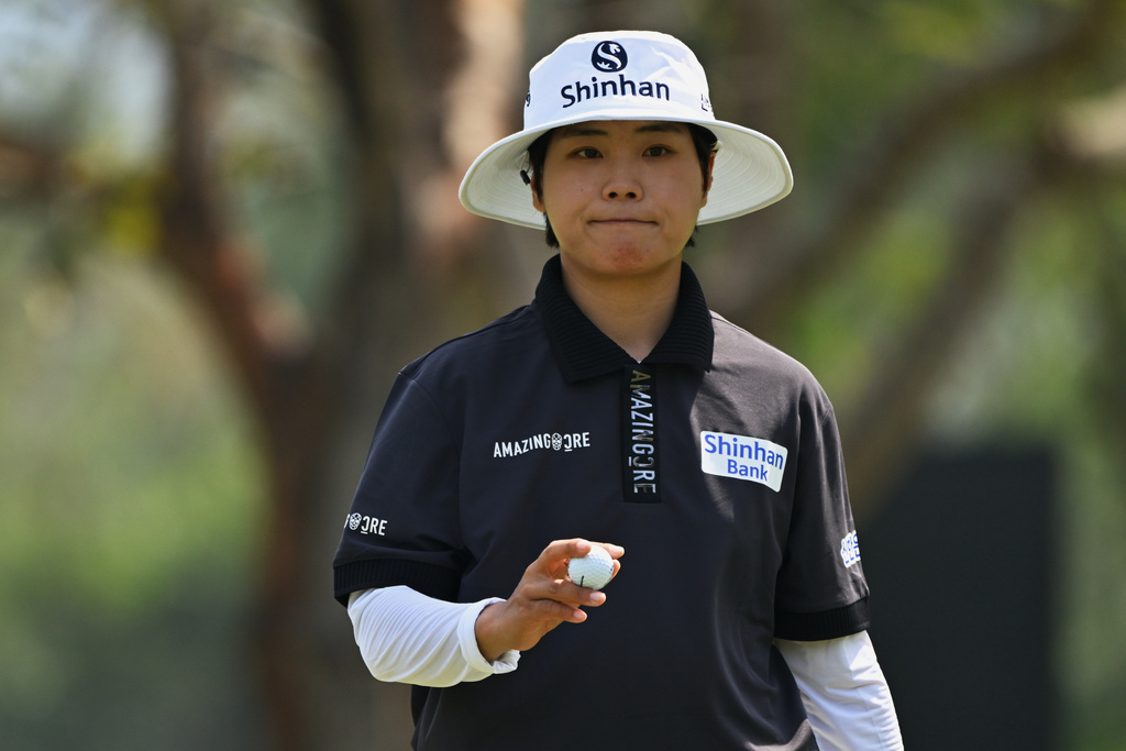 Somi Lee of South Korea reacts after putting the ball on the 14th green during the first round of the LPGA Honda Thailand golf tournament in Pattaya, Thailand, Thursday, Feb. 19, 2026. (AP Photo/Kittinun Rodsupan)