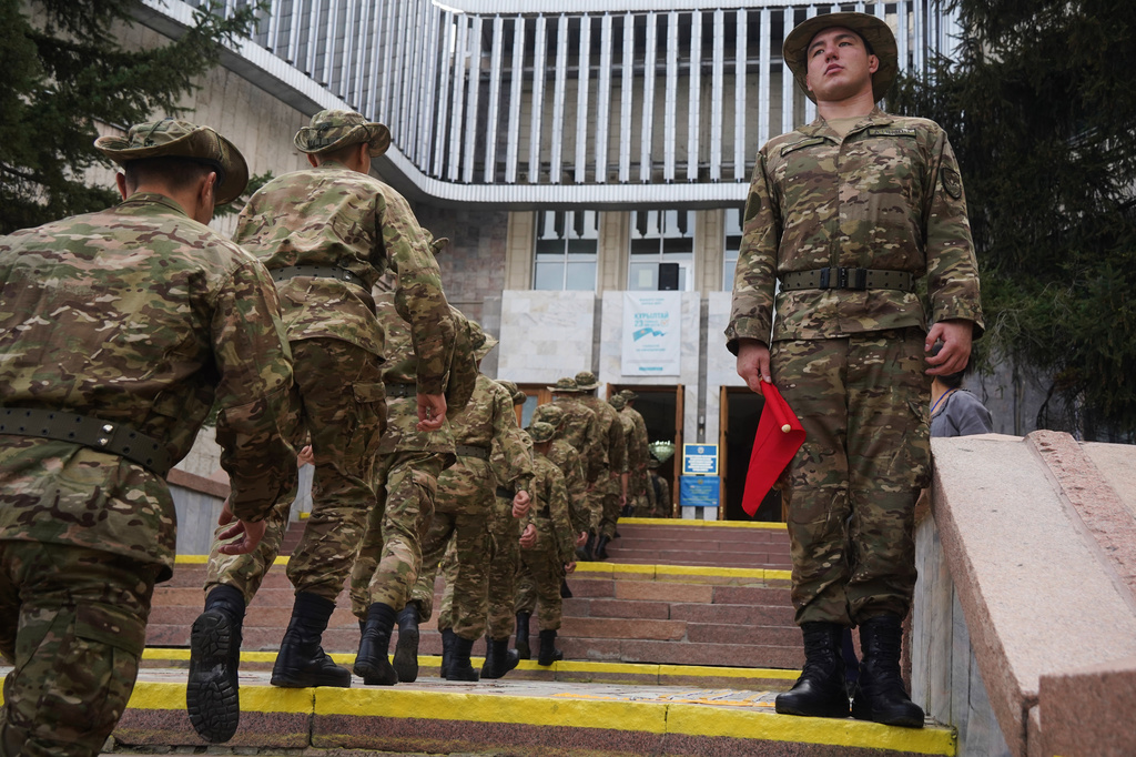 A Kazakhstan's soldiers line-up to vote at a polling station during early parliamentary elections in Almaty, Kazakhstan, Sunday, Aug. 23, 2026. (AP Photo/Vladimir Tretyakov)