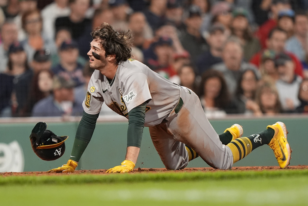 Athletics Jacob Wilson gets up diving safely into home on an RBI double by Tyler Soderstrom in the sixth inning against the Boston Red Sox in a baseball game, Tuesday, Sept. 16, 2025, in Boston. (AP Photo/Robert F. Bukaty)
