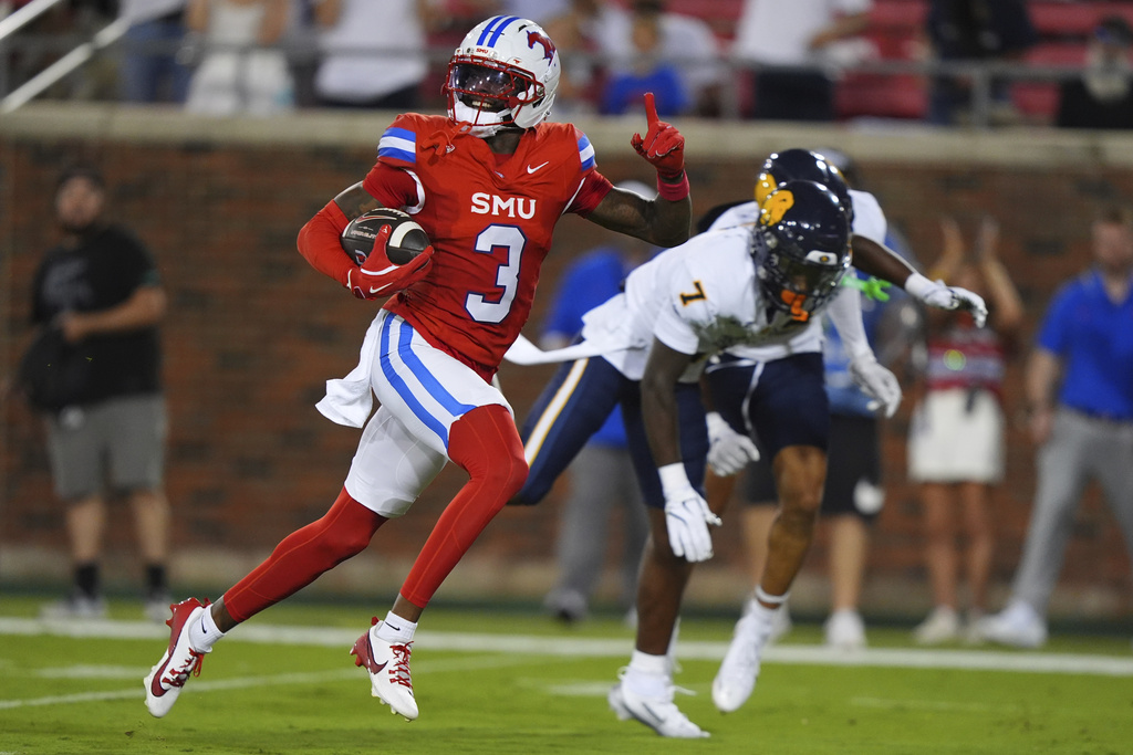 SMU wide receiver Romello Brinson (3) runs for a touchdown after catching a pass against East Texas A&M defensive back Javon Gillespie (7) during the first half of an NCAA college football game Saturday, Aug. 30, 2025, in Dallas. (AP Photo/LM Otero)