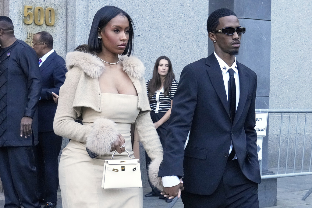 Christian "King" Combs, right, and Raven Tracy leave Federal Court, in New York, Friday, Oct. 3, 2025. (AP Photo/Richard Drew)