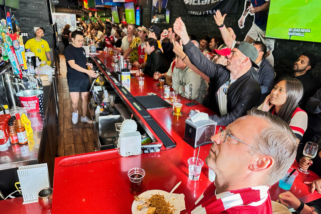 Fans watch a Champion league soccer match between Arsenal and Paris Saint-Germain at the Lion Sports Bar, Saturday, May 30, 2026, in Philadelphia. (AP Photo/Tassanee Vejpongsa)
