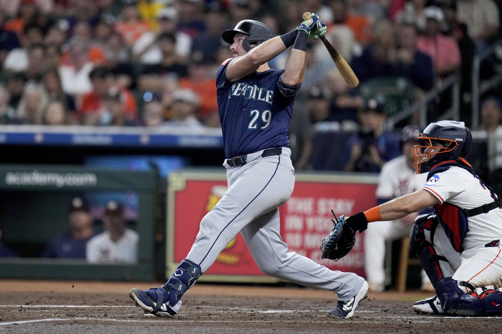 Seattle Mariners' Cal Raleigh (29) hits a solo home run, his 57th of the season, against the Houston Astros during the third inning of a baseball game Saturday, Sept. 20, 2025, in Houston. (AP Photo/Eric Christian Smith)