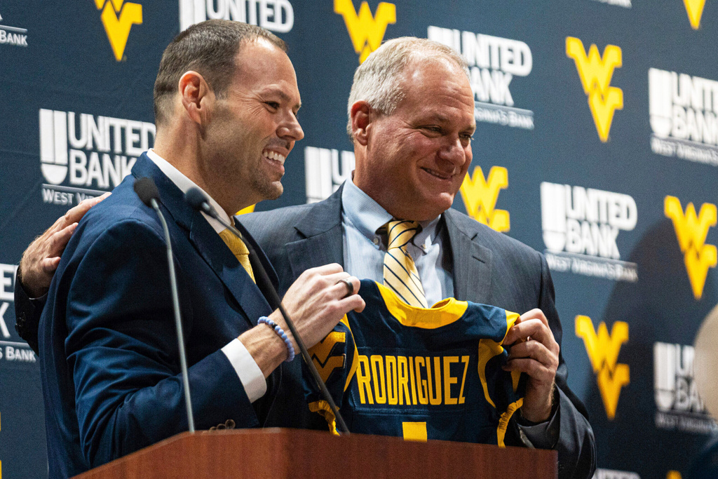 Despite a returning coach , West Virginia lost dozens of players to the transfer portal