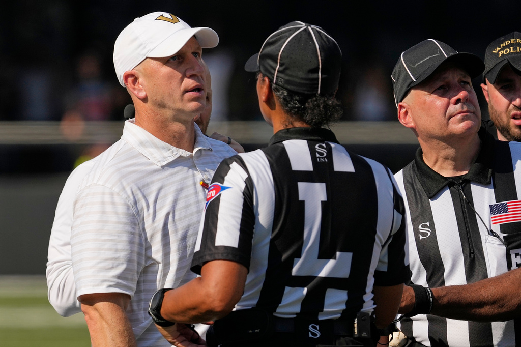 Vanderbilt head coach Clark Lea talks to officials during the second half of an NCAA college football game against North Carolina State, Saturday, Sept. 19, 2026, in Nashville, Tenn. (AP Photo/George Walker IV)