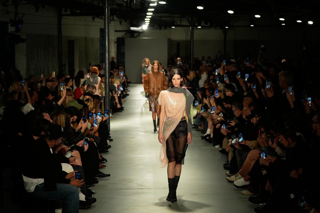Models wear creations part of the N21 women's Spring-Summer 2026 collection, that was presented in Milan, Italy, Wednesday, Sept. 24, 2025. (AP Photo/Luca Bruno).