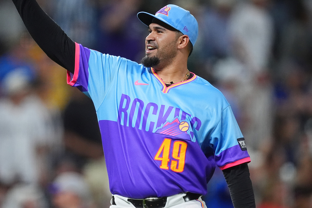 Colorado Rockies relief pitcher Antonio Senzatela reacts after getting Pittsburgh Pirates' Jared Triolo to hit into a double play with the bases loaded to end a baseball game Friday, June 19, 2026, in Denver. (AP Photo/David Zalubowski)