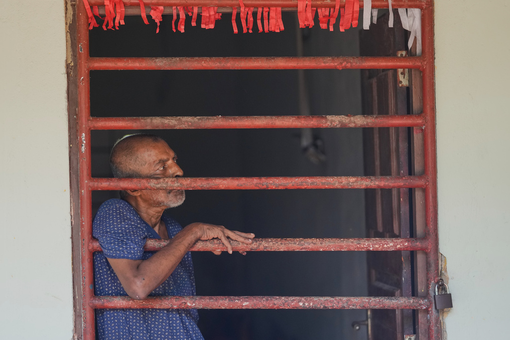 A resident looks outside from his dormitory at a nursing home in Anguruwatota, Sri Lanka, Friday, June 5, 2026.(AP Photo/Eranga Jayawardena)