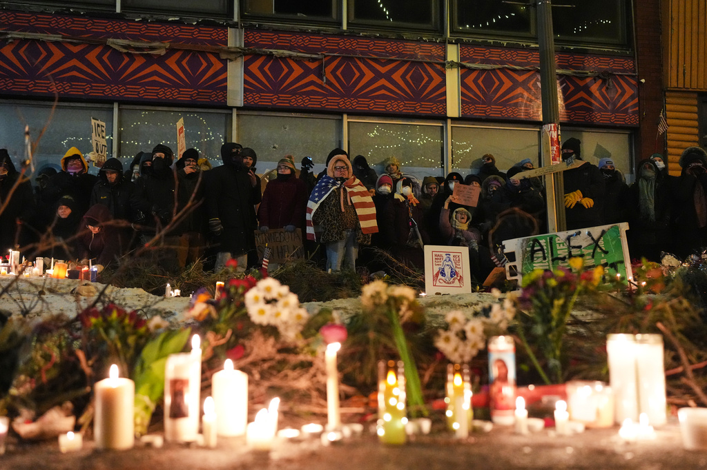 FILE - People gather during a vigil for 37-year-old Alex Pretti, who was fatally shot by a U.S. Border Patrol officer earlier in the day, Jan. 24, 2026, in Minneapolis. (AP Photo/Adam Gray, File)