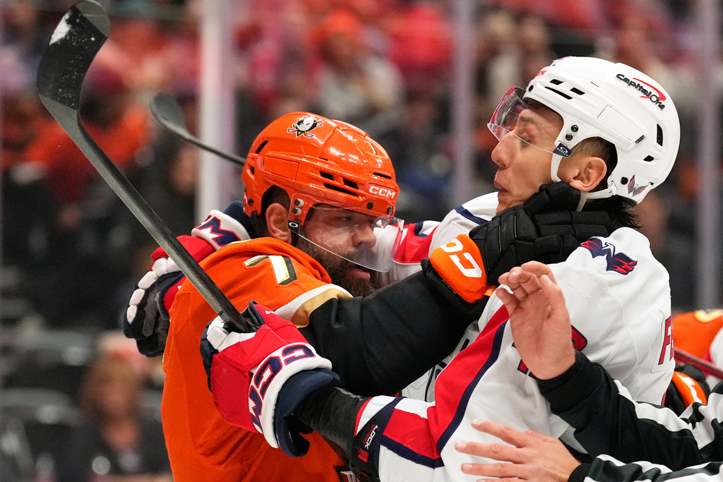 Anaheim Ducks defenseman Radko Gudas, left, and Washington Capitals defenseman Martin Fehérváry scuffle during the second period of an NHL hockey game Friday, Dec. 5, 2025, in Anaheim, Calif. (AP Photo/Mark J. Terrill)