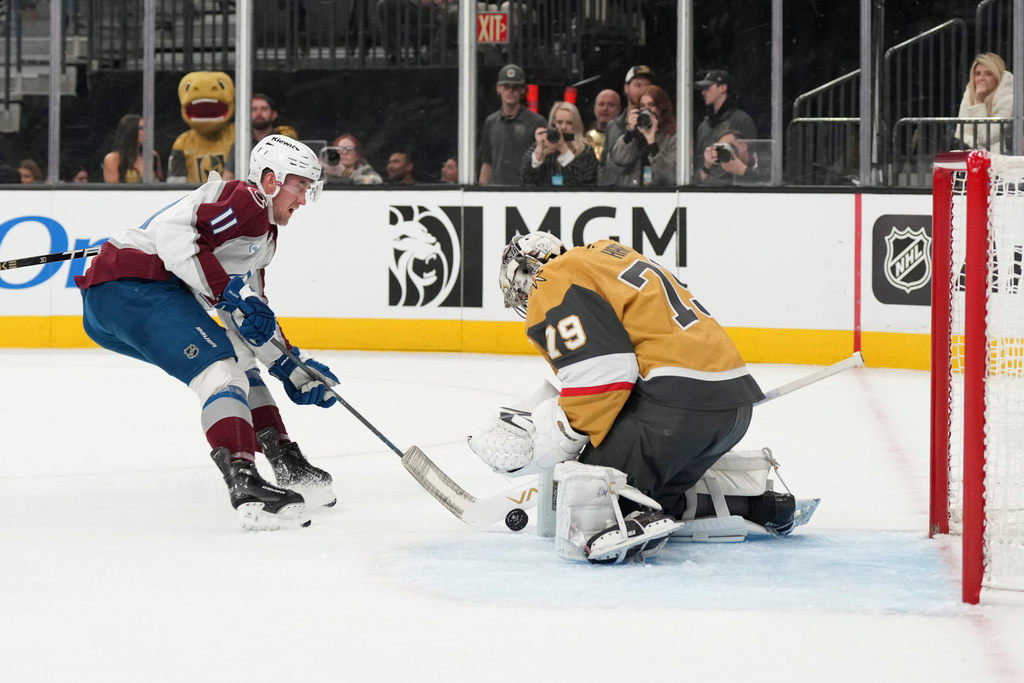 Vegas Golden Knights goaltender Carter Hart (79) stops a shot by Colorado Avalanche center Brock Nelson (11) during the first period of an NHL hockey game Saturday, Dec. 27, 2025, in Las Vegas. (AP Photo/Candice Ward)