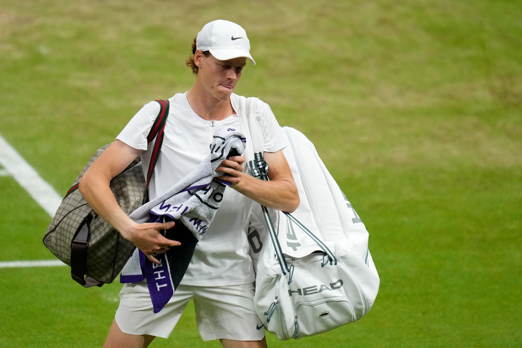 FILE - Italy's Jannik Sinner leaves the court after losing to Serbia's Novak Djokovic in their men's singles semifinal match on day twelve of the Wimbledon tennis championships in London on July 14, 2023. (AP Photo/Kirsty Wigglesworth, File)