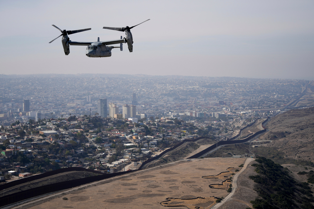 A U.S. Marine Osprey is flown over the border, Jan. 31, 2025, near San Diego. (AP Photo/Jae C. Hong, File)