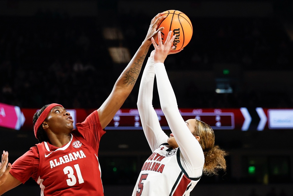 Alabama forward Naomi Jones (31) blocks shot of South Carolina guard Tessa Johnson during the first half of an NCAA college basketball game in Columbia, S.C., Thursday, Jan. 1, 2026. (AP Photo/Nell Redmond)