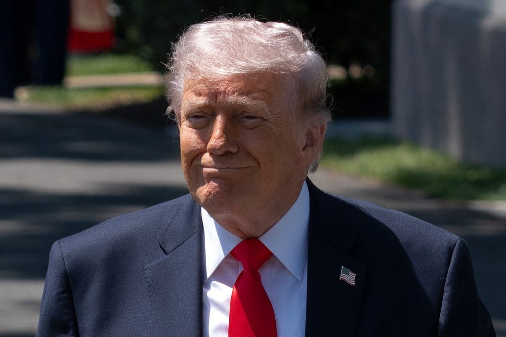 President Donald Trump walks to speak with reporters as he prepares to board Marine One on the South Lawn of the White House, Friday, May 1, 2026, in Washington. (AP Photo/Mark Schiefelbein)