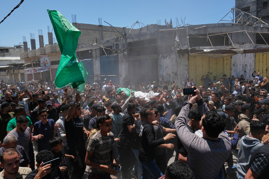 Palestinians attend the funerals of Hamas militant Imad Isleim, his wife and daughter, who were killed in an Israeli military strike, outside Al-Shafi'i Mosque in Gaza City, Thursday, May 28, 2026. (AP Photo/Jehad Alshrafi) CORRECTION: Corrects surname from al-Salem to Isleim