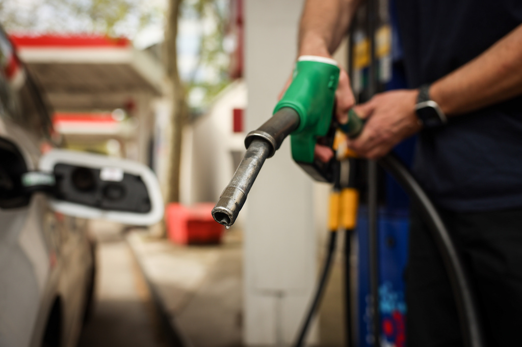 A customer fuels his vehicle at an Essence gas station in Paris, Sunday, April 5, 2026. (AP Photo/Thomas Padilla)