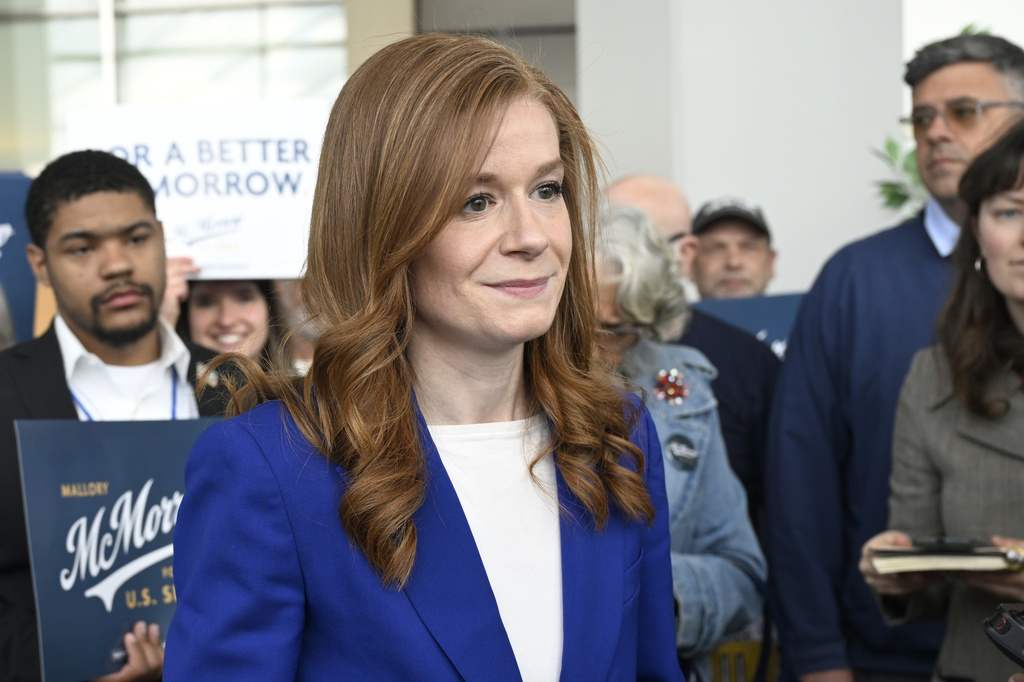 FILE - Michigan State Sen. Mallory McMorrow, D-Royal Oak, a candidate for the U.S. Senate, listens to questions from the media during the Michigan Democratic Party State Endorsement Convention, April 19, 2026, in Detroit. (AP Photo/Jose Juarez, File)