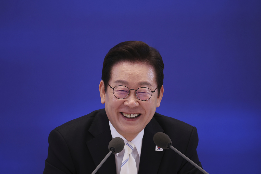 South Korean President Lee Jae Myung reacts during a news conference to mark 100 days in office at the Blue House in Seoul, South Korea, Sept, 11, 2025. (Kim Hong-Ji/Pool Photo via AP)