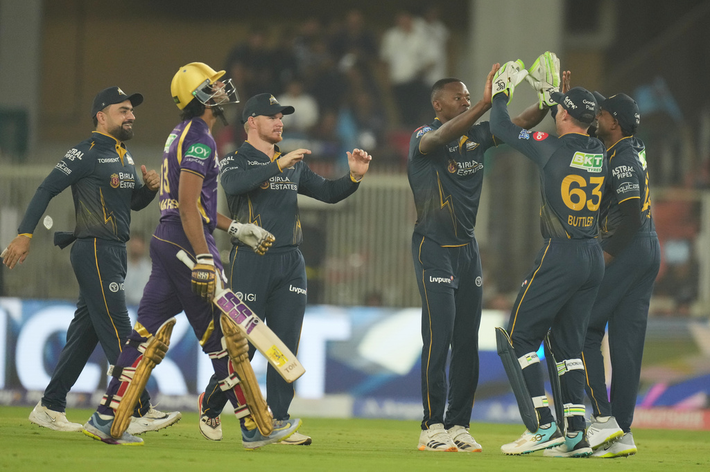 Gujarat Titans' Kagiso Rabada, third from right, celebrates with teammates the wicket of Kolkata Knight Riders' Angkrish Raghuvanshi, left, walks during the Indian Premier League cricket match between Gujarat Titans and Kolkata Knight Riders in Ahmedabad, India, Friday, April 17, 2026. (AP Photo/Ajit Solanki)