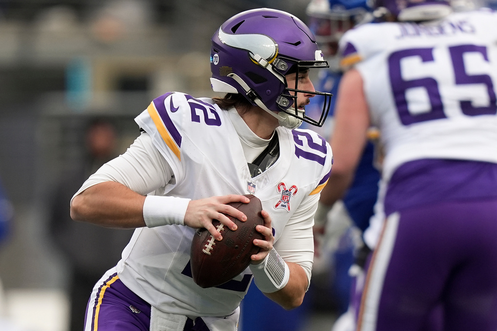 Minnesota Vikings quarterback Max Brosmer (12) looks to pass against the New York Giants during the third quarter of an NFL football game, Sunday, Dec. 21, 2025, in East Rutherford, N.J. (AP Photo/Frank Franklin II)