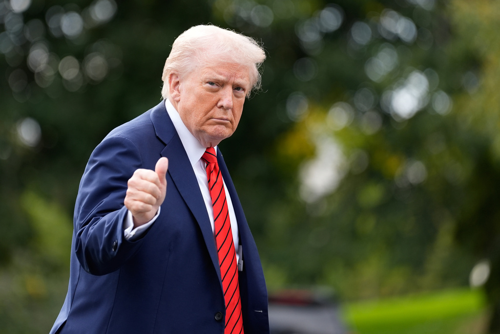 President Donald Trump walks on the South Lawn after arriving on Marine One at the White House, Friday, Oct. 10, 2025, in Washington. (AP Photo/Alex Brandon)