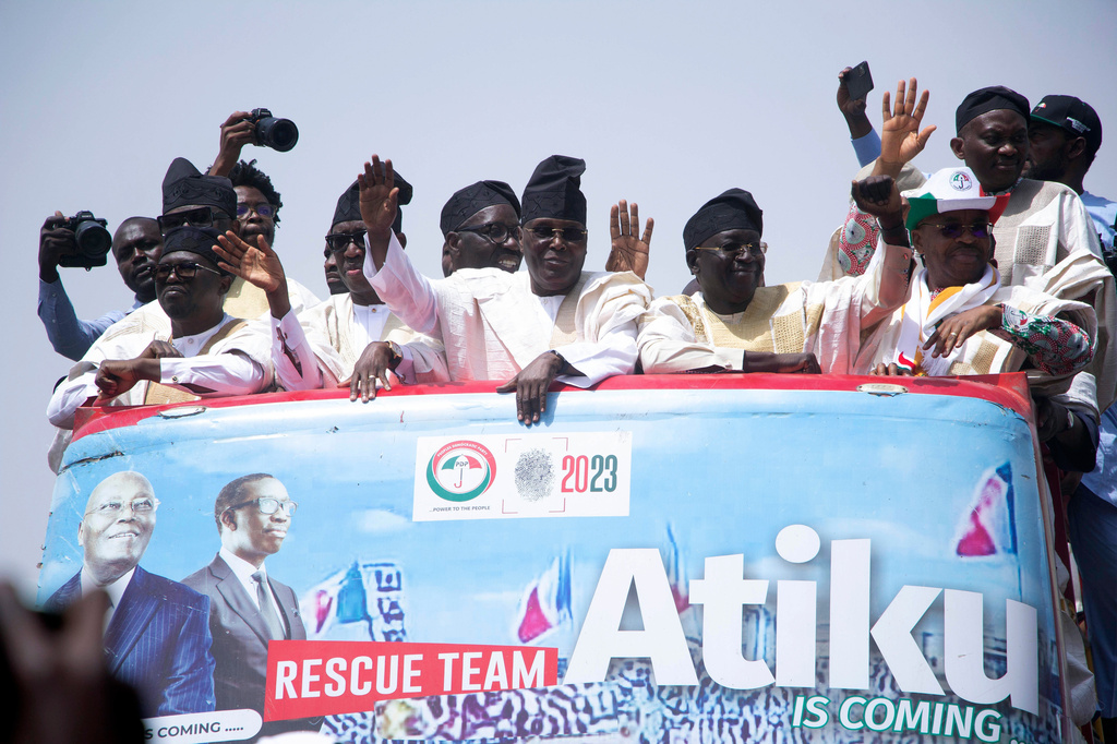 FILE- Atiku Abubakar, former presidential candidate of the People's Democratic party, and now Presidential Candidate of the African Democratic Congress, Nigeria's opposition party, Center, waves to his supporters during a presidential election campaign rally in Yola Nigeria, Saturday, Feb. 18, 2023. (AP Photo/Radeno Haniel, File)