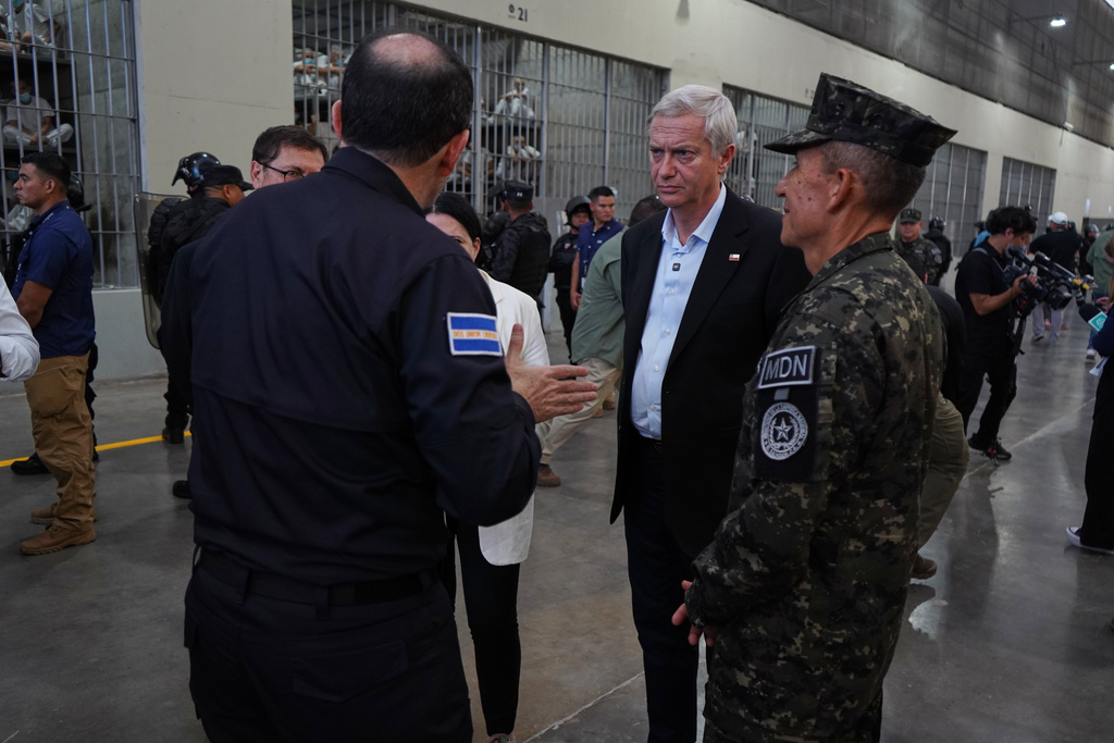 Chile's President-elect Jose Antonio Kast, center, is given a tour of the mega prison known as Detention Center Against Terrorism (CECOT) in Tecololuca, El Salvador, Friday, Jan. 30, 2026. (AP Photo/Salvador Melendez)