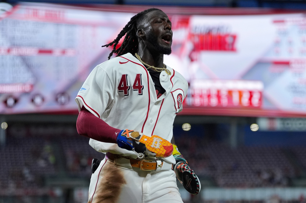 Cincinnati Reds shortstop Elly De La Cruz reacts as he scores on a wild pitch by Athletics pitcher Hogan Harris in the eighth inning of a baseball game in Cincinnati, Tuesday, Aug. 4, 2026. (AP Photo/Carolyn Kaster)