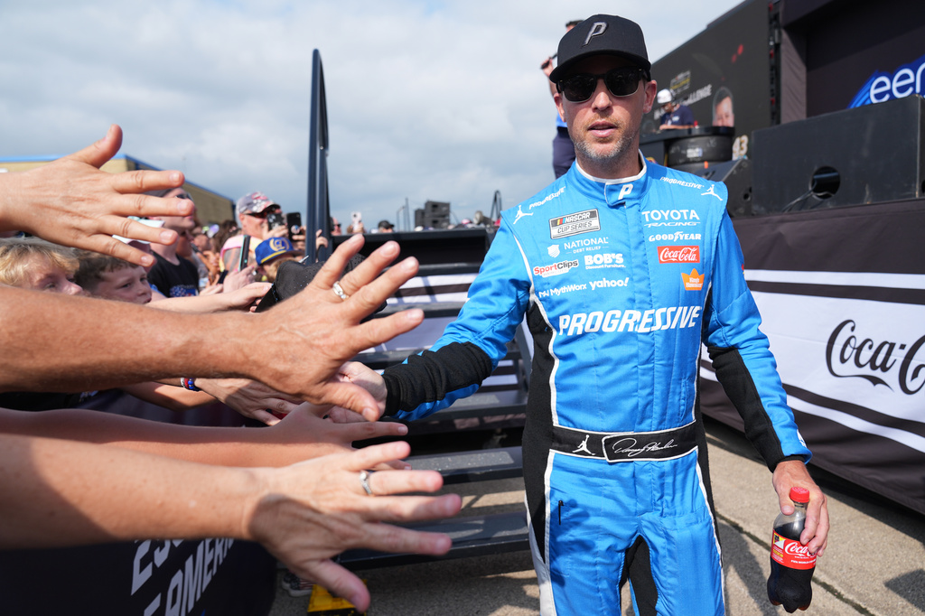 Denny Hamlin (11) greets fans before start of a NASCAR Cup Series auto race at Chicagoland Speedway in Joliet, Ill., Sunday, July 5, 2026. (AP Photo/Nam Y. Huh)