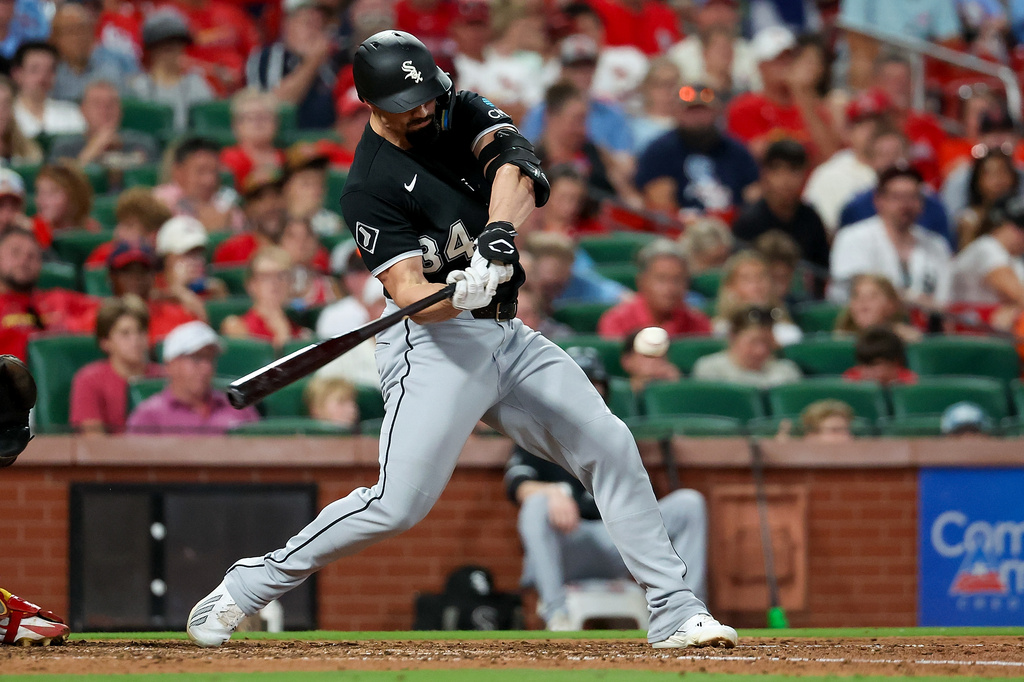 Chicago White Sox's Randal Grichuk hits a sacrifice RBI during the fifth inning of a baseball game against the St. Louis Cardinals Saturday, Sept. 12, 2026, in St. Louis. (AP Photo/Scott Kane)