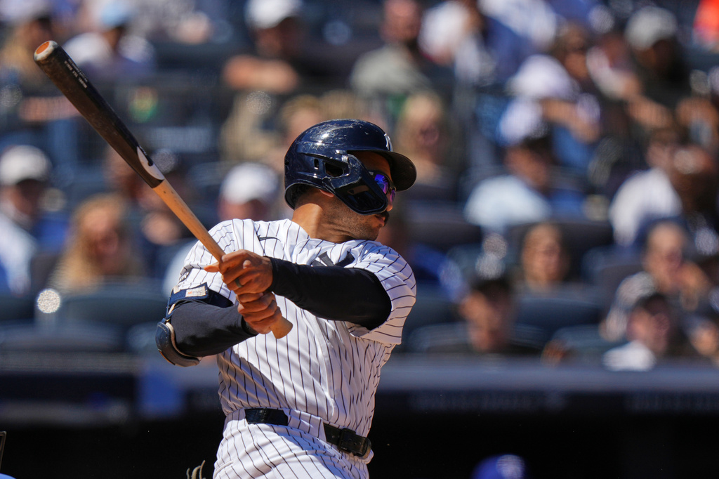 New York Yankees' Trent Grisham follows through on a three-run double during the sixth inning of a baseball game against the Texas Rangers Thursday, May 7, 2026, in New York. (AP Photo/Frank Franklin II)