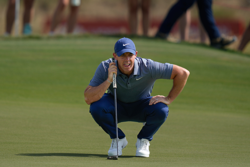 Rory McIlroy of Northern Ireland lines up a putt on the 7th green during the final round of Abu Dhabi Golf Championship in Abu Dhabi, United Arab Emirates, Sunday, Nov. 9, 2025. (AP Photo/Altaf Qadri)