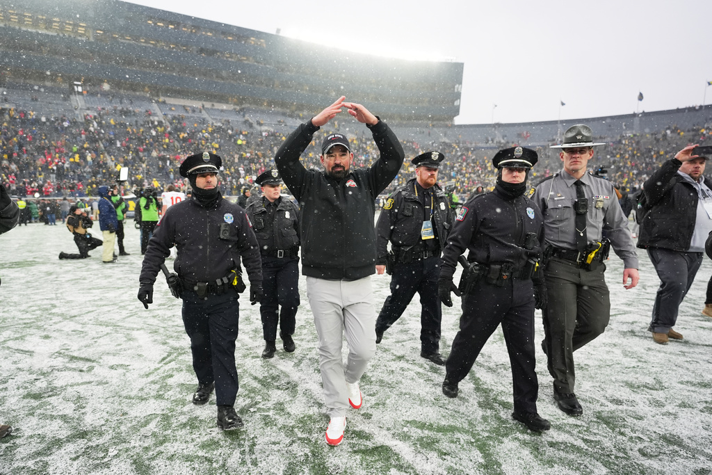 Ohio State Buckeyes head coach Ryan Day celebrates after the team's win against Michigan in an NCAA college football game, Saturday, Nov. 29, 2025, in Ann Arbor, Mich. (AP Photo/Ryan Sun)