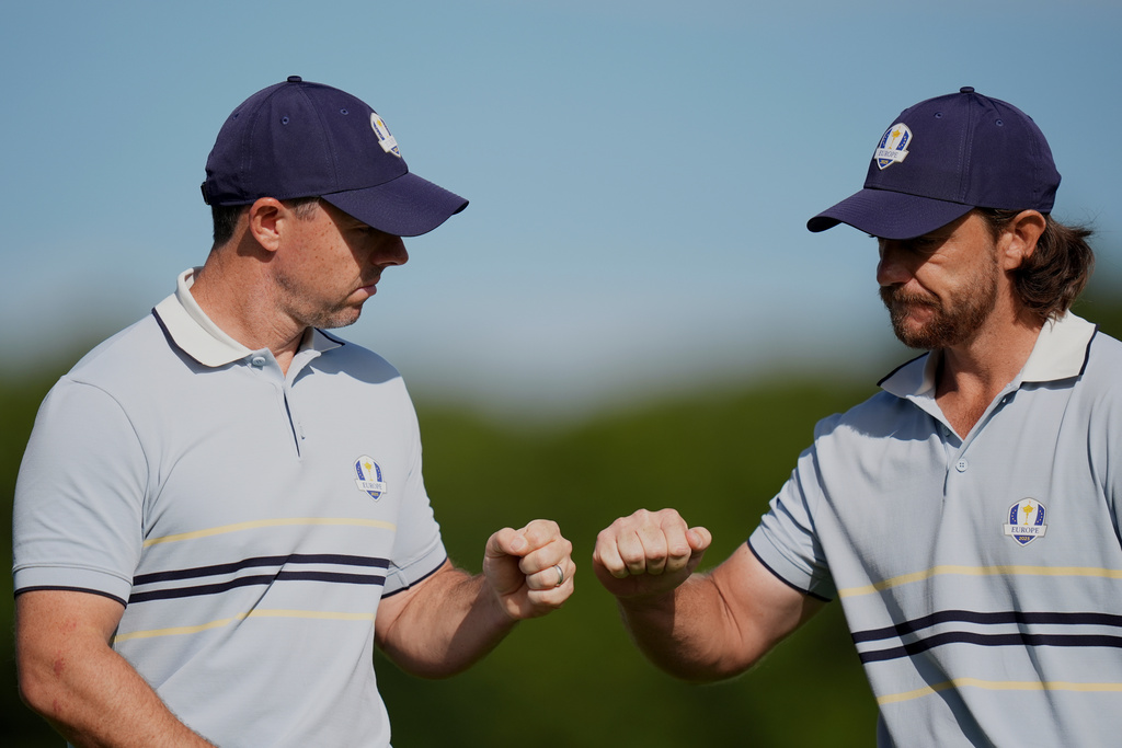 Europe's Tommy Fleetwood and Rory McIlroy celebrate on the 11th hole at Bethpage Black golf course during the Ryder Cup golf tournament, Friday, Sept. 26, 2025, in Farmingdale, N.Y. (AP Photo/Seth Wenig)