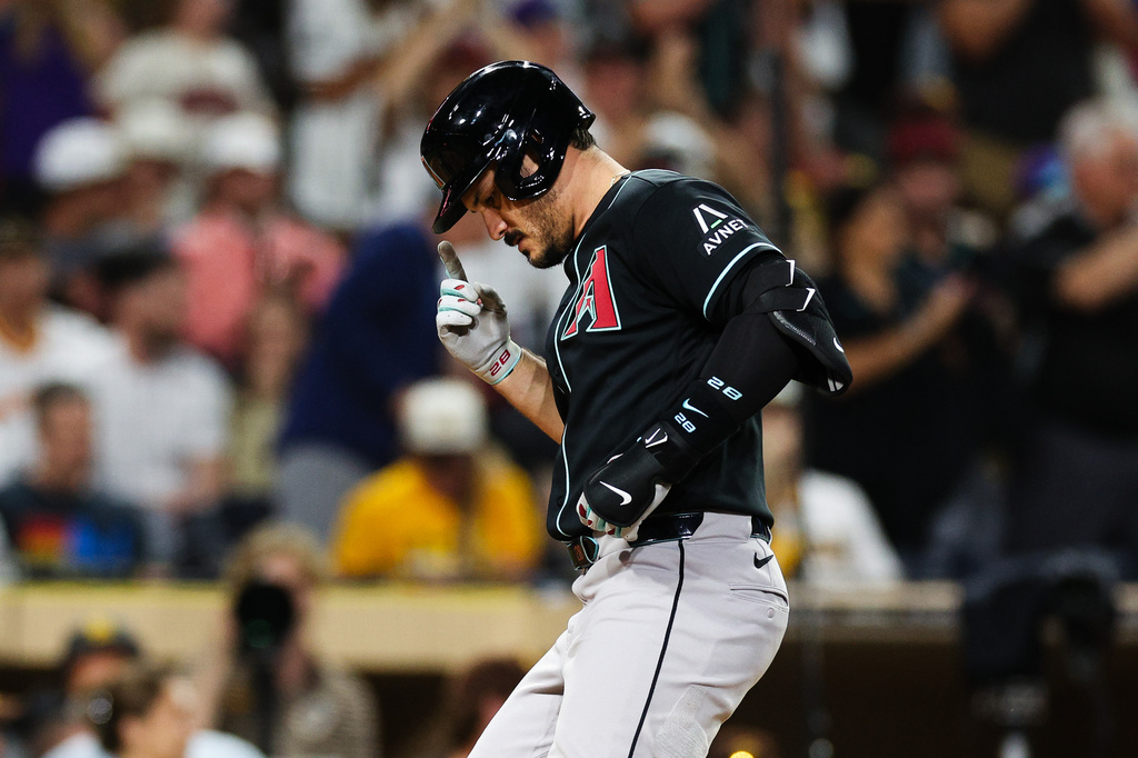 Arizona Diamondbacks' Nolan Arenado, gestures as he crosses the plate after hitting a solo home run against the San Diego Padres in the sixth inning of a baseball game Thursday, July 9, 2026, in San Diego. (AP Photo/Derrick Tuskan)