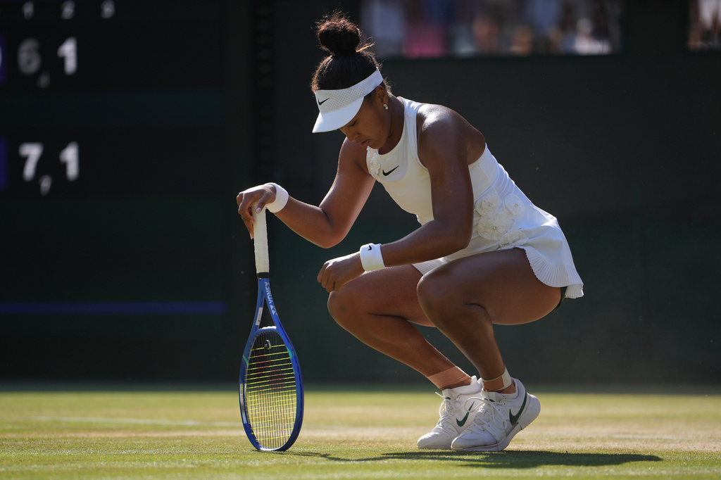 Naomi Osaka of Japan reacts to losing a point against Karolina Muchova of Czech Republic in their quarter-final women's singles match at the Wimbledon Tennis Championships in London, Tuesday, July 7, 2026. (AP Photo/Kin Cheung)