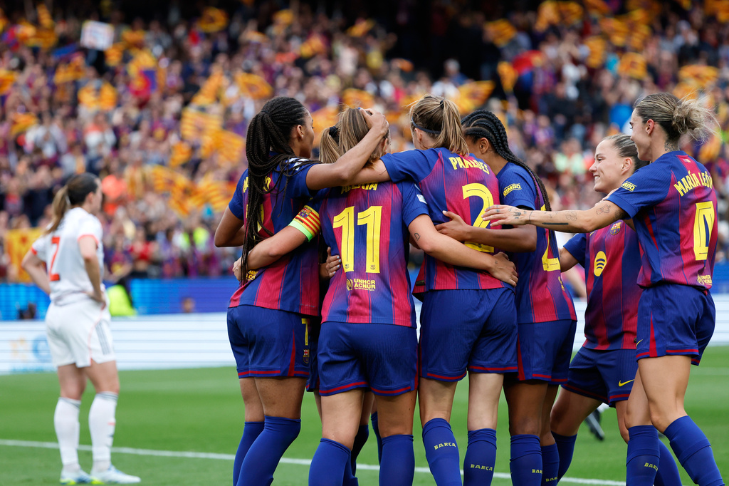 Barcelona players celebrate after Alexia Putellas scored their fourth goal during the women's Champions League semifinal soccer match between FC Barcelona and FC Bayern Munich in Barcelona, Spain, Sunday, May 3, 2026. (AP Photo/Joan Monfort)