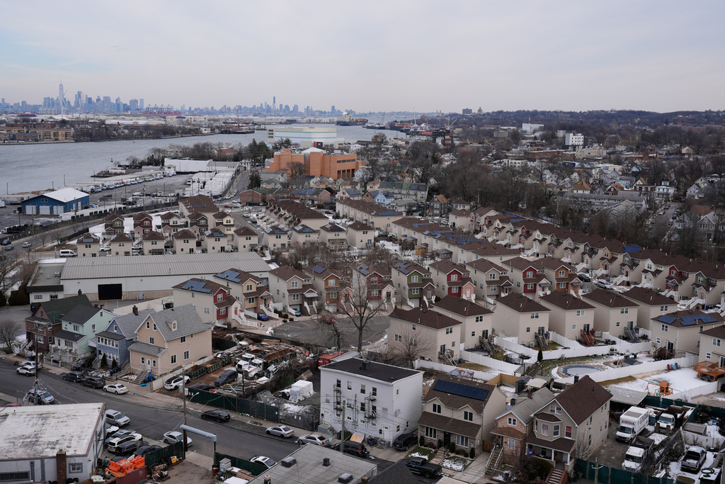 The skyline of lower Manhattan, top left, is seen behind the Staten Island borough of New York, Friday, Jan. 23, 2026. (AP Photo/Seth Wenig)