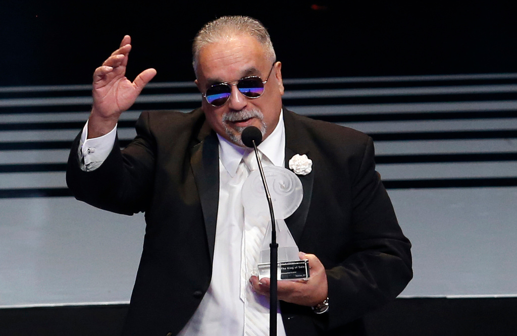 FILE - Willie Colon accepts the award for best musica afroamericana at the Lunas del Auditorio Nacional awards ceremony in Mexico City, Oct. 31, 2018. Colón, considered by many to be the "architect of urban salsa," died Saturday, Feb. 21, 2026. He was 75. (AP Photo/Claudio Cruz, File)