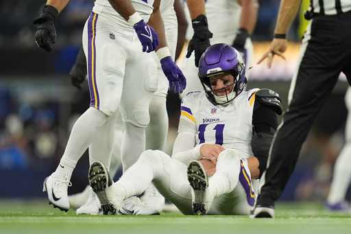 Minnesota Vikings quarterback Carson Wentz (11) sits on the ground after a hit during the second half of an NFL football game against the Los Angeles Chargers Thursday, Oct. 23, 2025, in Inglewood, Calif. (AP Photo/Gregory Bull) Minnesota Vikings quarterback Carson Wentz (11) sits on the ground after a hit during the second half of an NFL football game against the Los Angeles Chargers Thursday, Oct. 23, 2025, in Inglewood, Calif. (AP Photo/Gregory Bull)