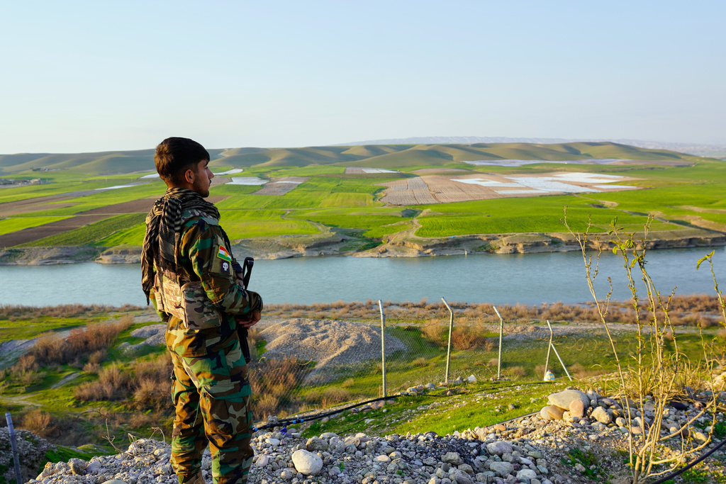 A member of the Kurdistan Freedom Party PAK, stand guard in Irbil, Iraq, Thursday, March 5, 2026. (AP Photo/Rashid Yahya)