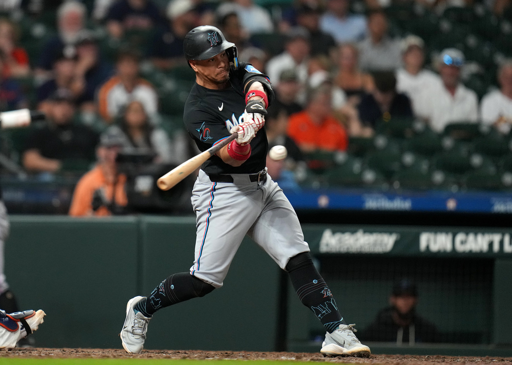 Miami Marlins' Heriberto Hernandez hits an RBI single off Houston Astros relief pitcher Josh Hader during the ninth inning of a baseball game, Monday, July 20, 2026, in Houston. (AP Photo/Karen Warren)